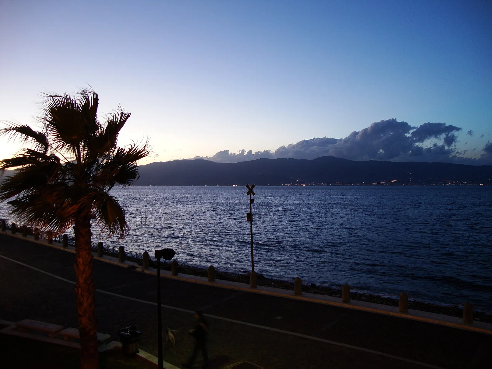 Palm-lined Lungomare Falcomatà promenade by the sea
