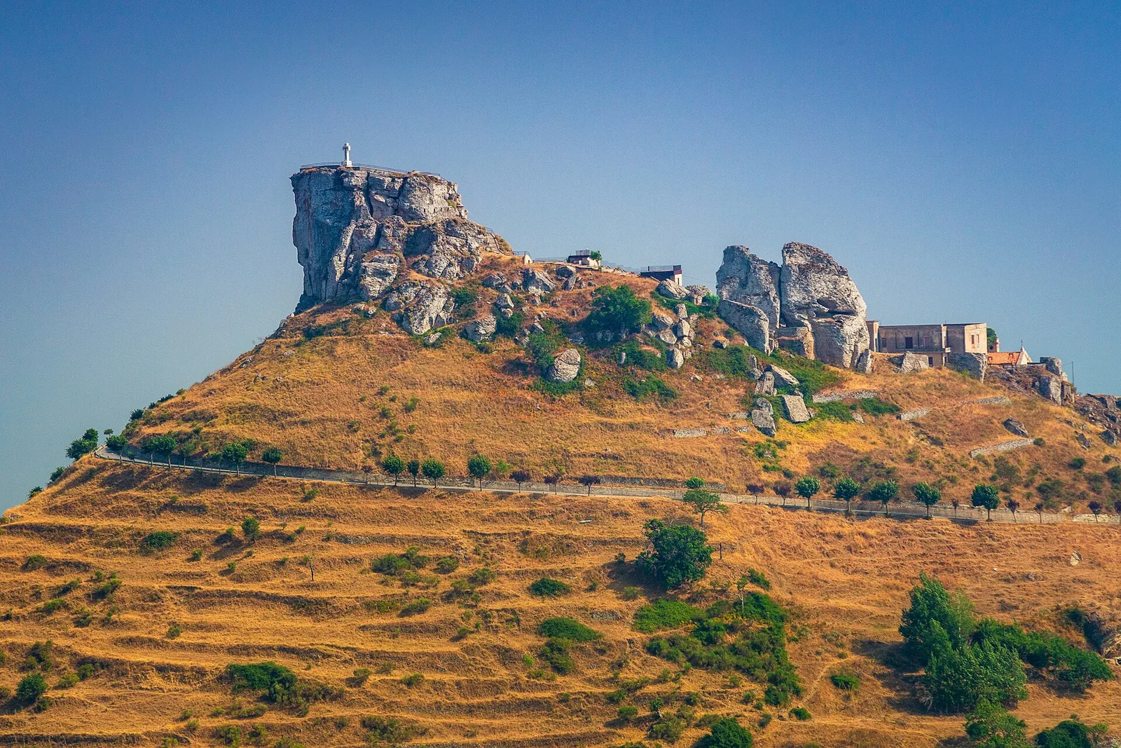 Norman castle ruins above Bova on a rocky hill.