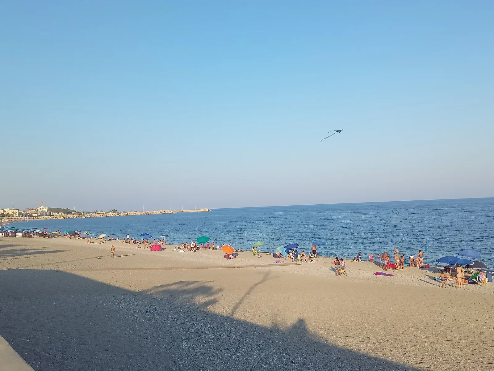Catanzaro Lido beach with umbrellas and calm sea