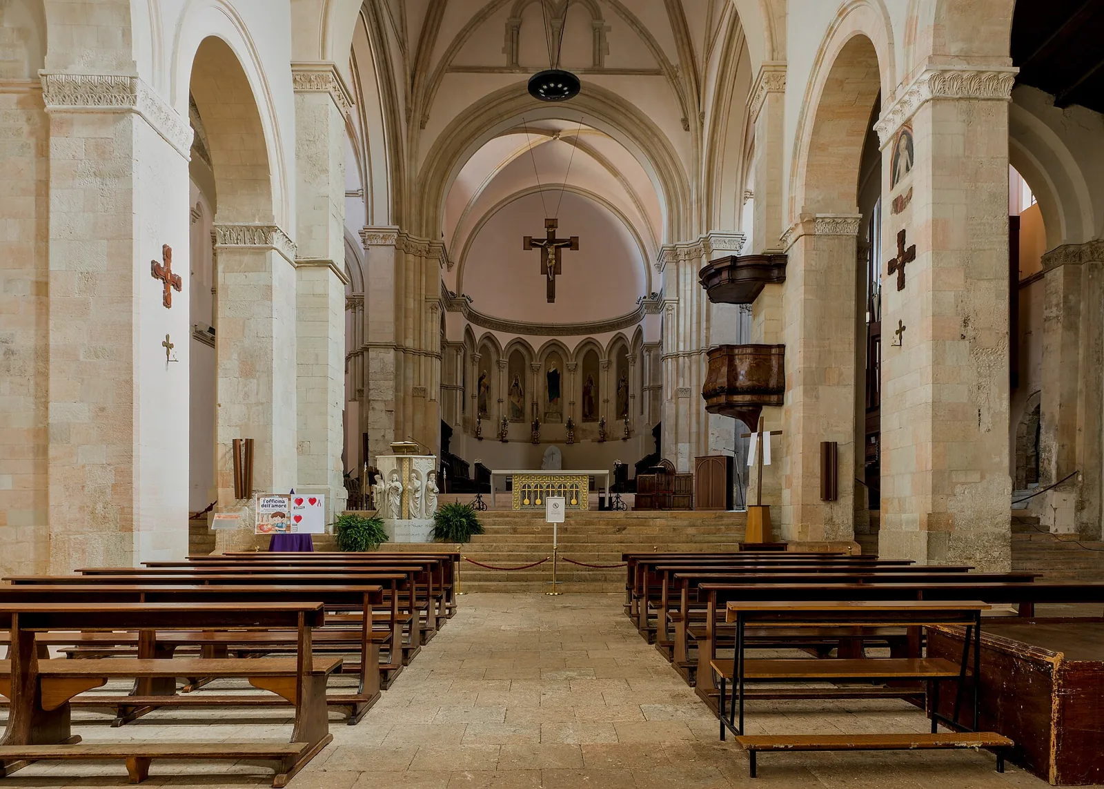 Interior of Cosenza Cathedral with nave and altar.