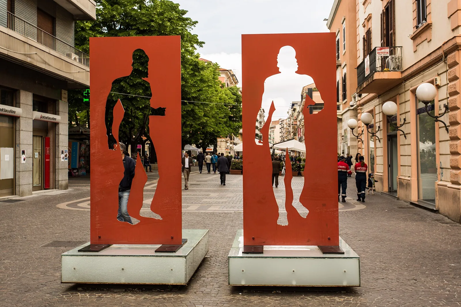 Two metal silhouettes on Corso Mazzini in Cosenza