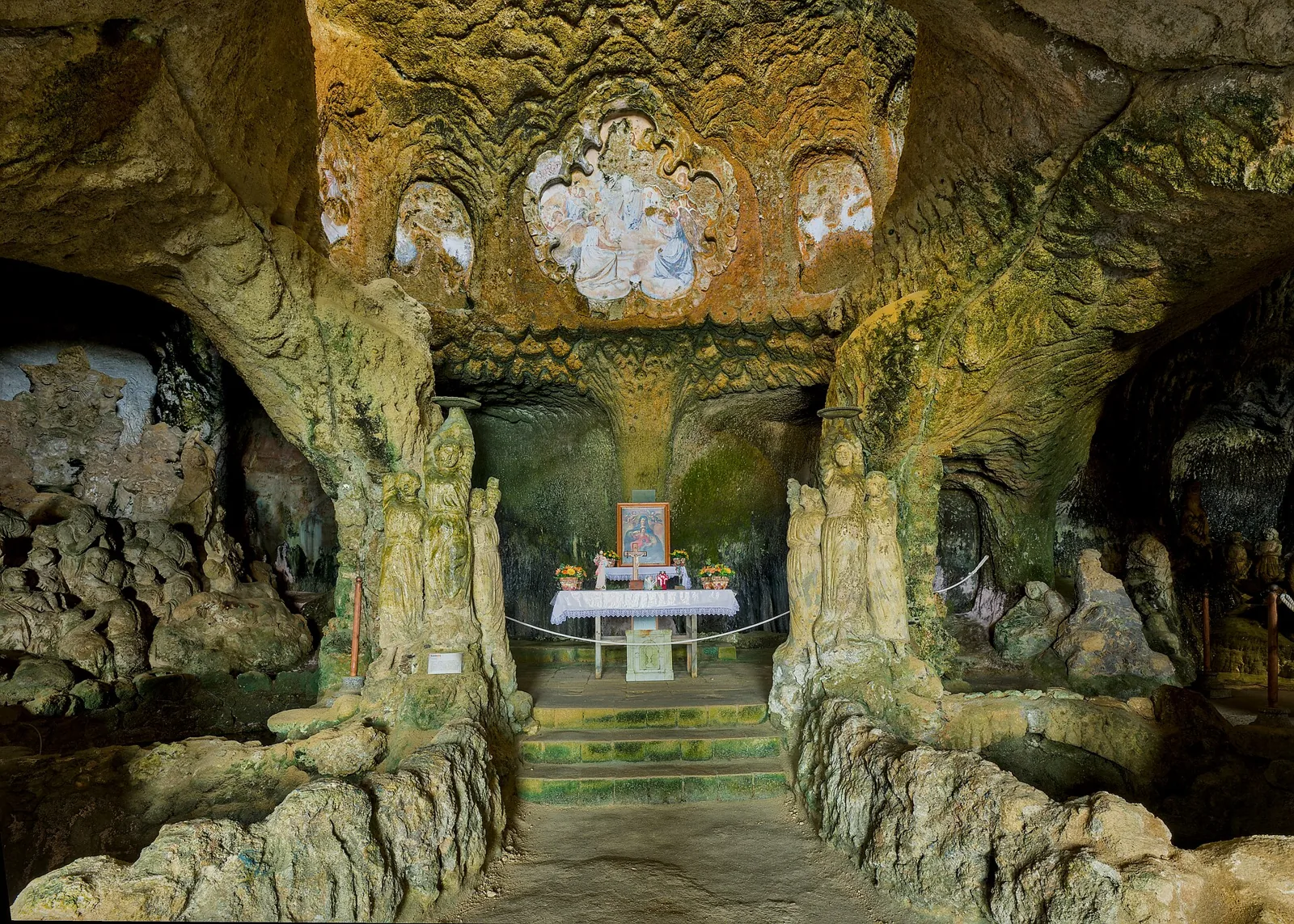 Interior of Chiesetta di Piedigrotta with altar and sculptures