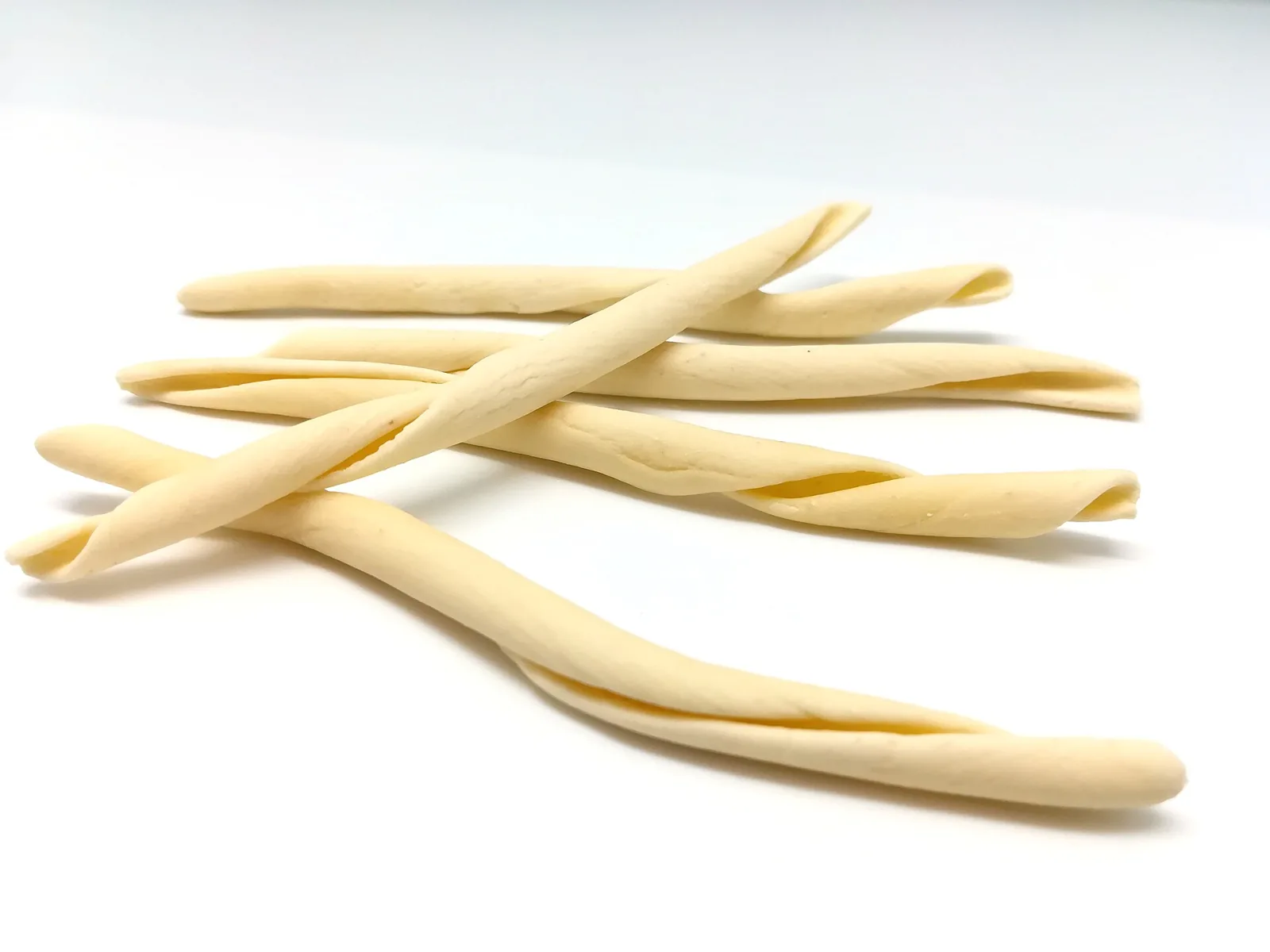Raw fileja pasta on a white background in Calabria