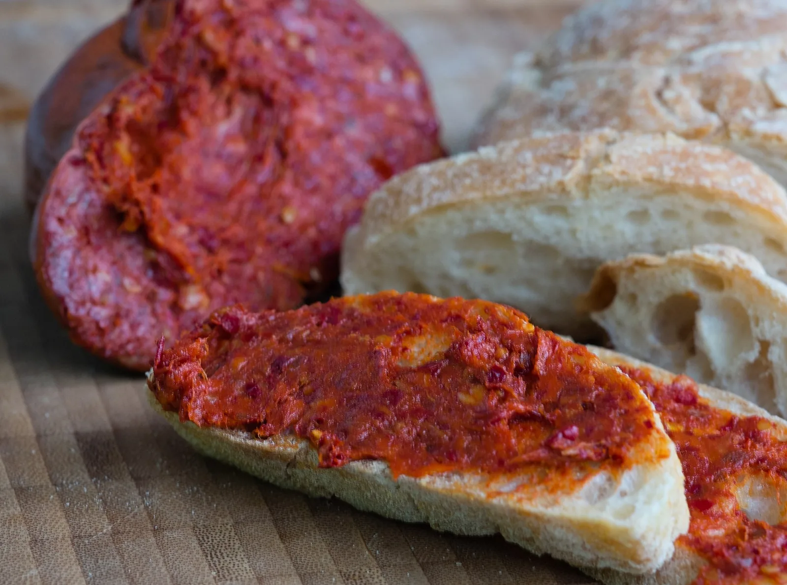 'Nduja on bread with a sliced salume